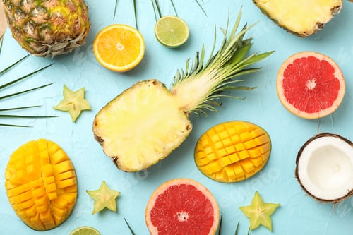 Preview: Composition with exotic fruits on blue background, top view