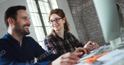 Preview: Portrait of young designers working on computer