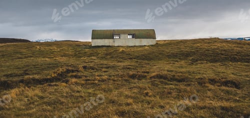 Preview: Abandoned warehouse in a wasteland near a meadow.