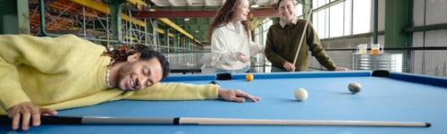 Preview: Header of Young Adult Multiethnic Friends Laughing and Playing Billiards Indoors