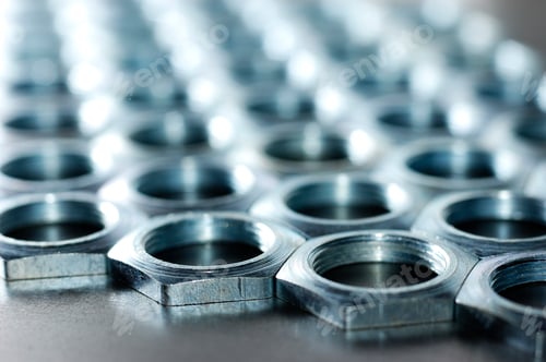 Preview: Close-up chrome metal nuts. Metal lines
