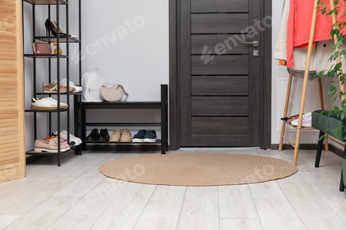 Preview: Many different shoes on racks in entryway