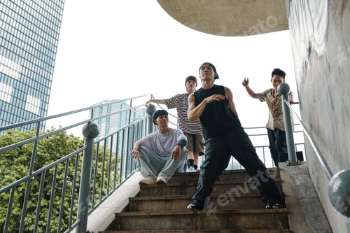 Preview: Group of Friends Posing on Urban Stairway Outdoors