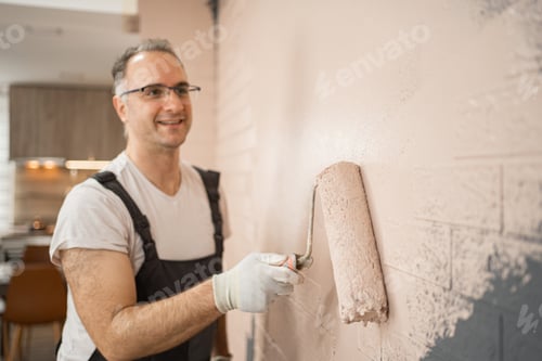 Preview: Man Painting Wall With Paint Roller
