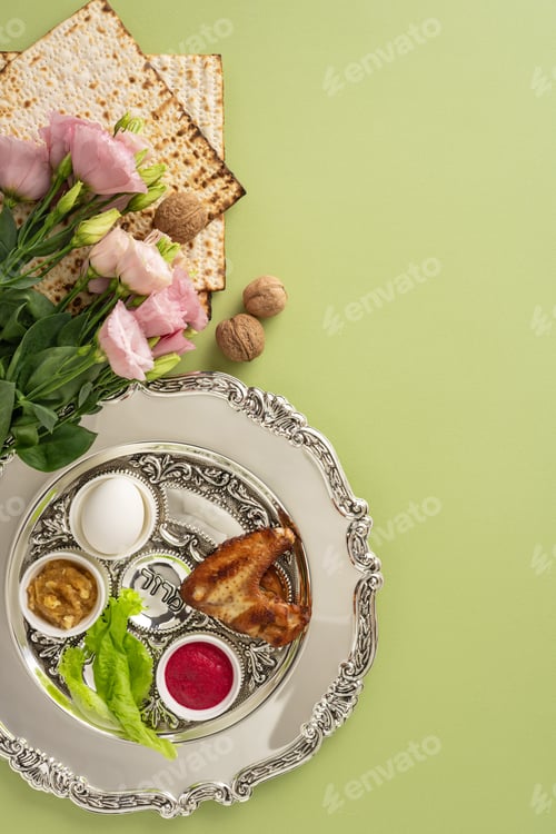 Preview: A decorated vertical silver seder plate with traditional symbolic foods, flowers