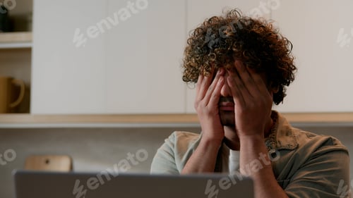 Preview: Close up Indian ill tired sleepy man with curly hair rubbing dry eyes Arabian exhausted sick guy