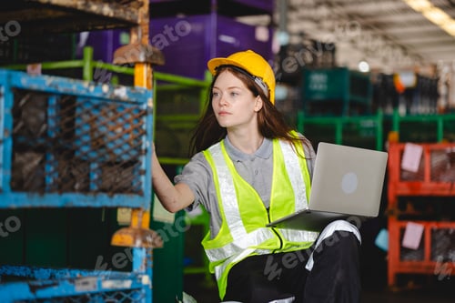 Preview: paper cardboard manufacture factory concept, industry worker person working with recycling machine