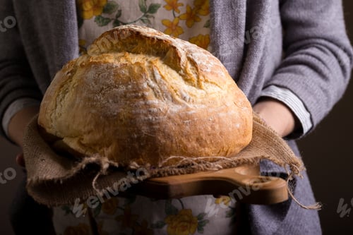 Preview: girl holding fresh white bread