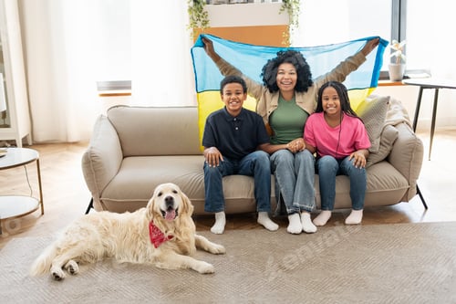 Preview: Portrait of smiling positive African American woman and her children mother holding Ukrainian flag