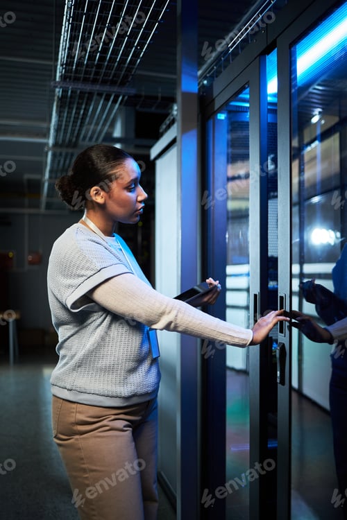 Preview: Woman Accessing a Secure Server Room with Keycard