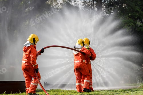 Preview: Firefighter Concept. Fireman using water and extinguisher to fighting with fire flame.
