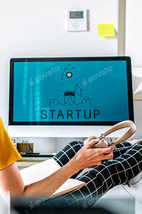 Preview: Woman sitting with her legs up