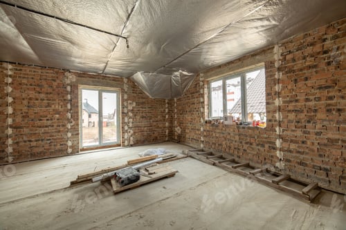 Preview: Interior of unfinished brick house with concrete floor and bare walls ready for plastering under
