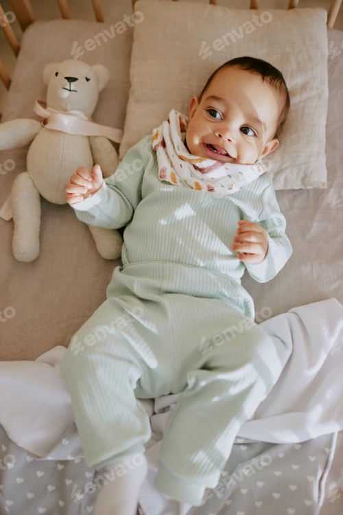 Preview: Male Infant Looking at His Mom and Smiling