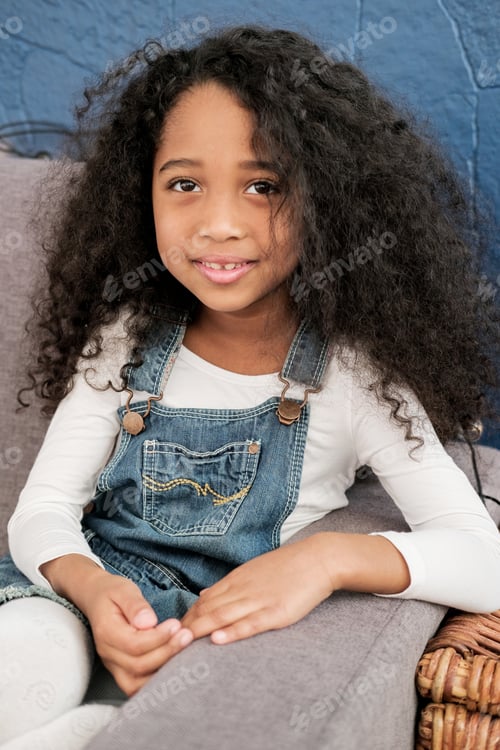 Preview: The African American Child Looks Directly Into The Camera In The Children'S Room.