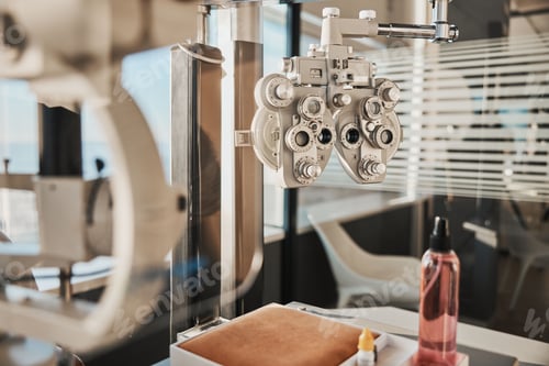 Preview: Vision, optometry and eye health in an optician office with an ophthalmic phoropter machine for tes