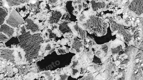 Preview: Top-down view to the textures and patterns of the cracked sea-ice formations