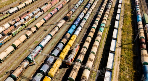 Preview: aerial top view of industrial cargo trains on a railway tracks f