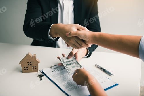 Preview: Home sales agents and buyers work on signing new homes and shaking hands.