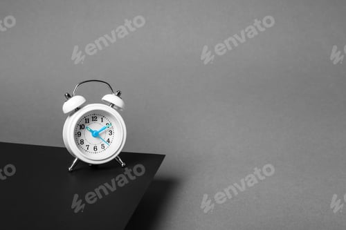 Preview: Alarm clock on dark background. Space for text