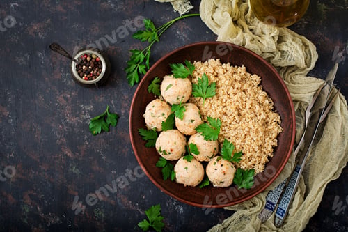 Preview: Baked meatballs of chicken fillet with garnished with quinoa.