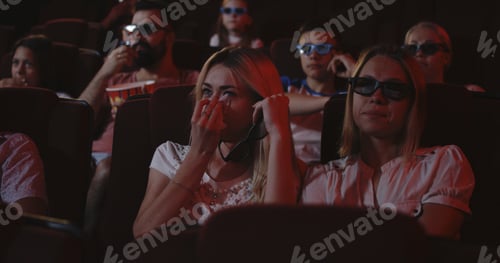 Preview: Medium Close-Up Of A Woman Crying While Watching A Sad Movie In A Cinema