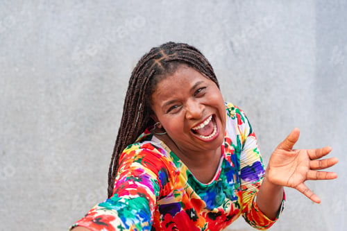 Preview: Latin woman with braids laughs in the street