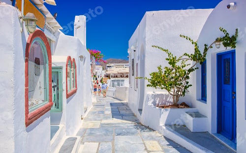 Preview: White churches an blue domes by the ocean of Oia Santorini Greece, traditional Greek village