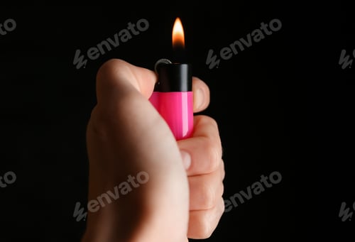 Preview: Woman holding pink lighter on black background, closeup