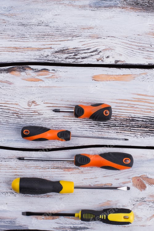 Preview: Set of various screwdrivers on wooden background