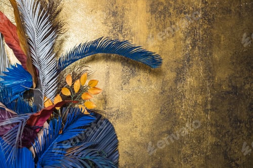 Preview: Creative layout with colorful tropical leaves on golden background. Minimal summer exotic concept