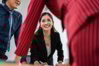 Preview: Group of multi-Ethnic businessman and businesswoman clapping together.