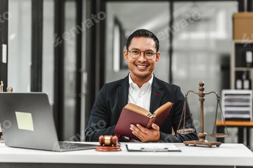 Preview: Handsome businessman lawyer of Indian descent. trusted litigation lawyers attorneys.