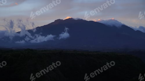 Preview: Beautiful view of Turrialba Volcano shadowed by dark blue evening colors and covered with fog