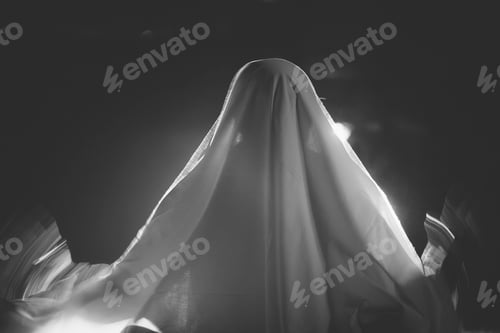 Preview: Halloween concept with ghost on a foggy night.