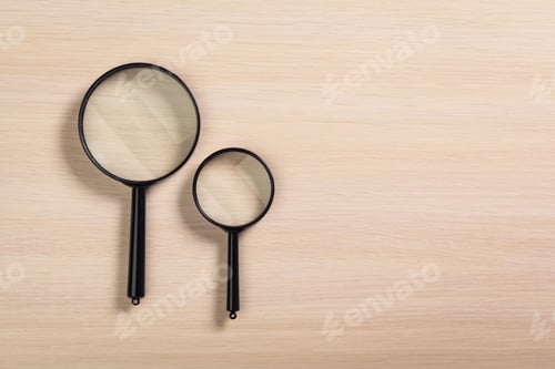 Preview: magnifying glass on the wooden background
