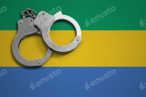 Preview: Gabon flag and police handcuffs. The concept of crime and offenses in the country.