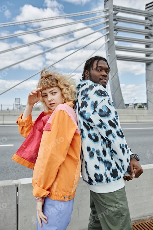 Preview: Two young people wearing colorful clothes outdoors