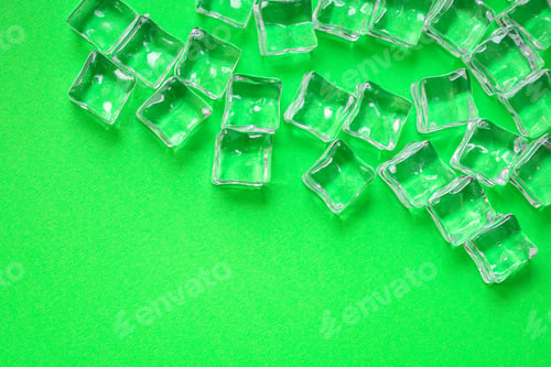 Preview: Ice Cubes. Artificial Crystal Clear Transparent Piece. Concept. Food Background. Top View. Copy
