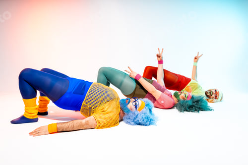 Preview: Group of drag queens lying on floor with reverse push up