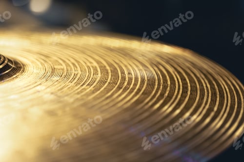 Preview: Drum cymbal close-up on a dark background.
