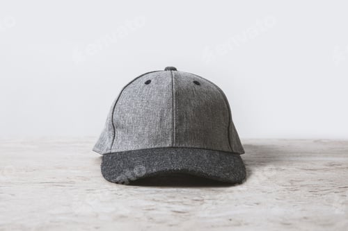 Preview: one grey cap on wooden table on white