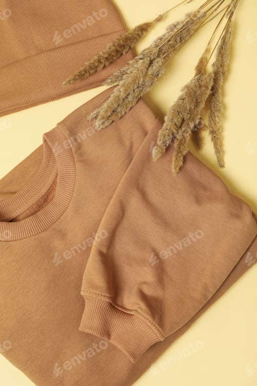 Preview: Stylish autumn wear on beige background, top view