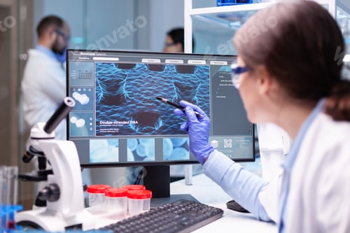 Preview: Professional biochemist analysing a medical experiment