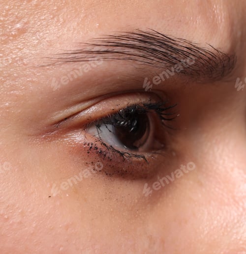 Preview: Closeup view of sad young woman crying