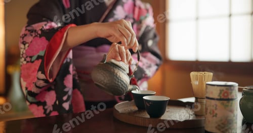 Preview: Japanese, hands and matcha for tea ceremony in Chashitsu room with kimono dress and traditional cus