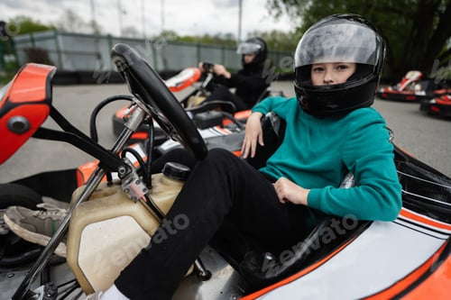 Preview: Children Enjoying Go-Kart Racing Outdoors for a Fun and Exciting Adventure