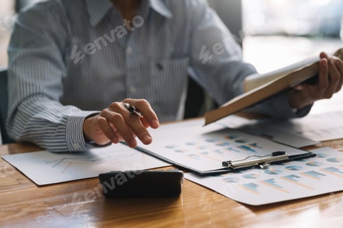Preview: Businessman sitting planning analyze investment and marketing on the desk in the office.