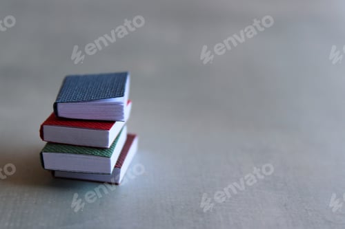 Preview: Books on concrete floor with copy space for text