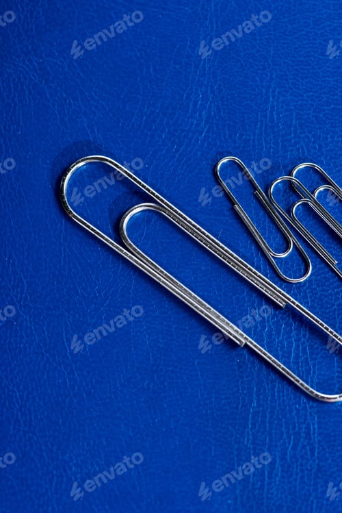 Preview: close up view of office paperclips on workplace